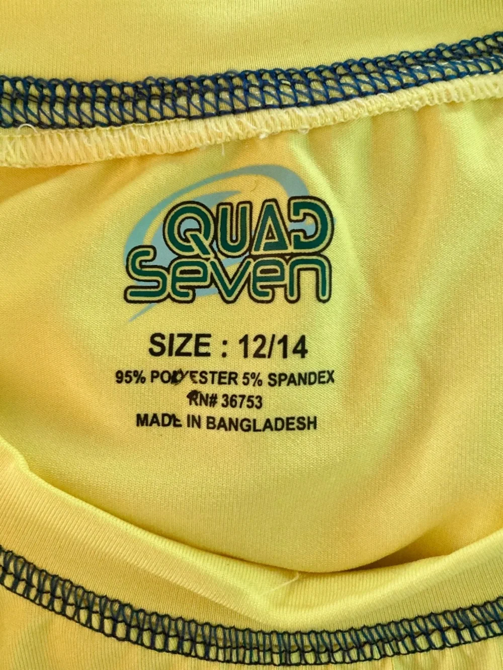 Boy’s size 12/14 Quad Seven banana yellow long sleeved swim shirt/rash guard